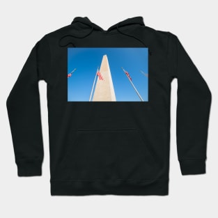 Washington Monument tall obelisk in National Mall Washington DC commemorating George Washington with flags Hoodie